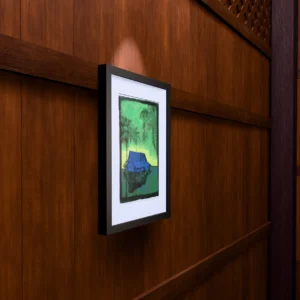 Drowning, gel plate monotype by Daniel Arendzen, framed on a wooden wall under a spotlight, seen from the side, with binoculars, a watch and a lighter on a table below. The room is a Blender render of the interior of the same traditional Malaysian house shown in the print.