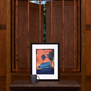 Frame 531 #3 - Room Frame 531 #3, gel plate monotype by Daniel Arendzen, framed and standing on a carved wooden cabinet under a barred window, with a mug for scale. The room is a Blender render of the interior of the same traditional Malaysian house shown in the print.