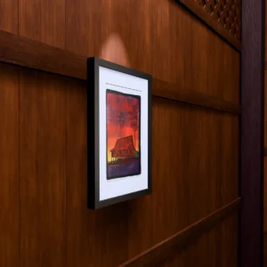 Shallow Water - Wall Shallow Water, gel plate monotype by Daniel Arendzen, framed on a wooden wall under a spotlight, seen from the side, with binoculars, a watch and a lighter on a table below. The room is a Blender render of the interior of the same traditional Malaysian house shown in the print.